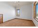 Bright bedroom with neutral carpeting and natural light at 10385 Grande Vista Ct, Lone Tree, CO 80124