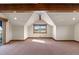 Spacious bedroom with vaulted ceiling, large window, and wood beams at 10385 Grande Vista Ct, Lone Tree, CO 80124