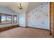 Bedroom with floral wall art, window seat, and a built-in ladder at 10385 Grande Vista Ct, Lone Tree, CO 80124