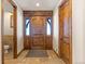 Elegant entryway with hardwood floors and high ceilings at 10385 Grande Vista Ct, Lone Tree, CO 80124