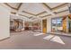 Spacious great room with hardwood floors, high ceilings and a partial kitchen view at 10385 Grande Vista Ct, Lone Tree, CO 80124
