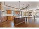 Open kitchen with an island, custom cabinetry, and stainless steel appliances at 10385 Grande Vista Ct, Lone Tree, CO 80124