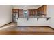 Kitchen features granite countertops and dark wood cabinets at 10385 Grande Vista Ct, Lone Tree, CO 80124