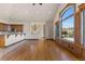 Living room boasts hardwood floors and large windows with scenic views at 10385 Grande Vista Ct, Lone Tree, CO 80124