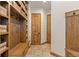 Functional mudroom with built-in bench, storage and hooks at 10385 Grande Vista Ct, Lone Tree, CO 80124