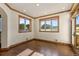 Home office with wood floors and large windows offering natural light at 10385 Grande Vista Ct, Lone Tree, CO 80124