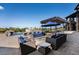 Relaxing patio with fire pit and comfortable seating at 10385 Grande Vista Ct, Lone Tree, CO 80124