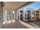 Expansive balcony with wood flooring, offering scenic neighborhood views and outdoor living space at 1778 Peak Loop, Broomfield, CO 80023