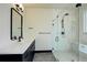 Modern bathroom featuring glass shower, sleek vanity with white countertop, and contemporary fixtures at 1778 Peak Loop, Broomfield, CO 80023