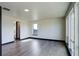 Spacious bedroom featuring hardwood floors and large window at 1778 Peak Loop, Broomfield, CO 80023