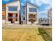 Modern townhomes feature large windows and private balconies in a community setting at 1778 Peak Loop, Broomfield, CO 80023