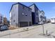 Modern townhomes with two-car garages and contemporary siding, located in a vibrant neighborhood at 1778 Peak Loop, Broomfield, CO 80023