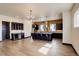 Stylish kitchen with island seating, stainless steel appliances and wood floors at 1778 Peak Loop, Broomfield, CO 80023