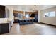 Modern kitchen features a central island with seating and ample counter space at 1778 Peak Loop, Broomfield, CO 80023