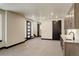 Open-concept living and kitchen space with modern cabinetry, sleek countertops, and recessed lighting at 1778 Peak Loop, Broomfield, CO 80023