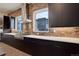 Modern kitchen featuring stainless steel appliances, a brick backsplash, and matte cabinets at 1778 Peak Loop, Broomfield, CO 80023