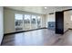 Bright living room with large windows overlooking the neighborhood, and a contemporary fireplace at 1778 Peak Loop, Broomfield, CO 80023
