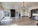 Bright living room featuring hardwood floors, a modern fireplace, and a sliding glass door at 1778 Peak Loop, Broomfield, CO 80023