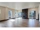 Spacious living room showcases hardwood floors, fireplace, and access to outdoor balcony at 1778 Peak Loop, Broomfield, CO 80023