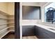 A butler's pantry area, equipped with ample shelving, storage cabinets, and a convenient sink at 1778 Peak Loop, Broomfield, CO 80023