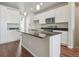 Modern kitchen with white cabinets and granite island at 453 Interlocken Blvd # 102, Broomfield, CO 80021