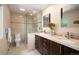 Modern bathroom featuring a glass-enclosed shower and double vanity at 7414 S Monroe Ct, Centennial, CO 80122
