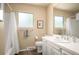 Bright bathroom with a shower/tub combo, tile flooring, and updated sink at 7414 S Monroe Ct, Centennial, CO 80122