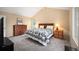 Cozy bedroom with comfortable bed, wood furnishings, and natural light, creating a relaxing retreat at 7414 S Monroe Ct, Centennial, CO 80122