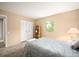 Light bedroom with closet, side table, and a window view at 7414 S Monroe Ct, Centennial, CO 80122