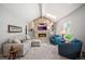 Bright living room featuring vaulted ceilings, stone fireplace and comfortable seating at 7414 S Monroe Ct, Centennial, CO 80122