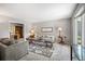 Comfortable living room area with neutral tones and plush seating, with natural light at 7414 S Monroe Ct, Centennial, CO 80122