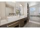Elegant bathroom features double sinks, a spacious shower, and modern fixtures, creating a spa-like retreat at 3615 Navajo St, Denver, CO 80211