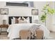 Bright bedroom features neutral decor, stylish art, and oversized windows offering plenty of natural light at 3615 Navajo St, Denver, CO 80211