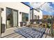 Relaxing outdoor deck with stylish seating, rug, and potted plants, perfect for entertaining or enjoying peaceful moments at 3615 Navajo St, Denver, CO 80211