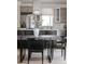 Chic dining area seamlessly blends into the modern kitchen, offering a perfect space for meals and gatherings at 3615 Navajo St, Denver, CO 80211