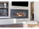 Living room fireplace surrounded by stone accents, built-in shelving, and contemporary finishes at 3615 Navajo St, Denver, CO 80211