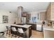 Modern kitchen features stainless steel appliances, a stylish island, and natural wood cabinets, perfect for cooking and entertaining at 3615 Navajo St, Denver, CO 80211
