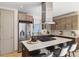 Well-equipped kitchen features stainless steel appliances, stylish cabinetry, and a large island, perfect for the home chef at 3615 Navajo St, Denver, CO 80211