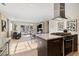 Open-concept living space with kitchen, dining, and living areas, featuring stylish furniture and contemporary design elements at 3615 Navajo St, Denver, CO 80211