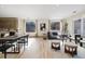 Sunlit living area with hardwood flooring, neutral decor, and oversized windows overlooking the outside scenery at 3615 Navajo St, Denver, CO 80211