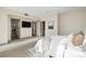 Airy main bedroom with TV, ensuite bathroom, and a calming color palette at 3615 Navajo St, Denver, CO 80211