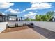 Spacious rooftop deck with wooden flooring and planter boxes, perfect for outdoor entertaining and relaxation at 3615 Navajo St, Denver, CO 80211
