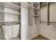 A walk-in closet featuring built-in shelves and hanging racks for ample storage at 3615 Navajo St, Denver, CO 80211