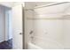 Clean, tiled shower and tub with built in soap dish and shower caddy in bathroom at 7483 S Quail Cir # 635, Littleton, CO 80127