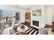 Bright living room featuring a fireplace, a sliding glass door, and stylish decor at 7483 S Quail Cir # 635, Littleton, CO 80127