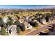 Expansive aerial shot of a neighborhood showcasing beautiful homes, golf courses, and lush landscapes at 9556 Kemper Dr, Lone Tree, CO 80124