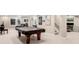 Recreational room in basement with seating, TV and pool table at 9556 Kemper Dr, Lone Tree, CO 80124
