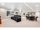 Large basement with comfortable seating, exercise equipment, and plenty of space for recreation at 9556 Kemper Dr, Lone Tree, CO 80124