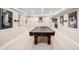 Spacious basement with a pool table, movie posters, and recessed lighting at 9556 Kemper Dr, Lone Tree, CO 80124