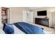 Neutral bedroom with a ceiling fan, large dresser, and en-suite bathroom at 9556 Kemper Dr, Lone Tree, CO 80124